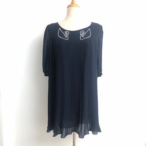 Navy pleated dress with pearl detail